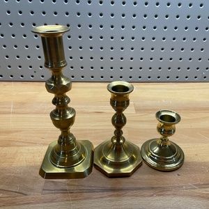 Three Varying Height Mismatched Gold Colored Candlestick Holders